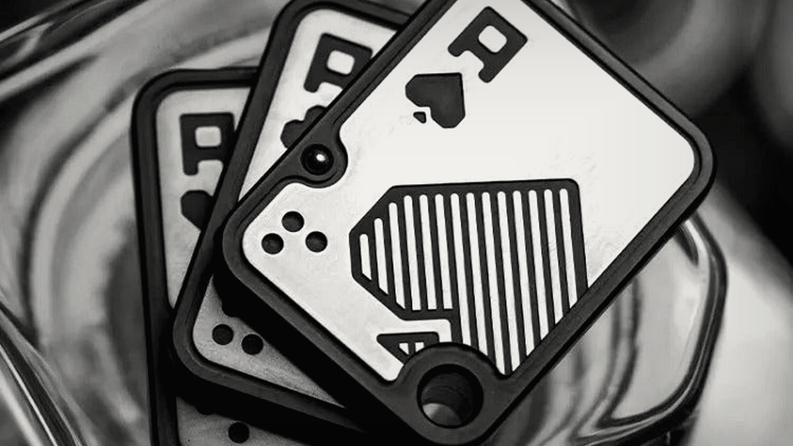 Black-and-white close-up of a precision-machined EDC fidget slider